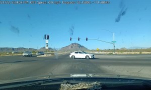 Car Does Doughnuts Through Traffic Intersection
