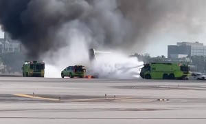 Emergency Crews Work to Extinguish Fire at Airport