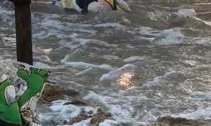 Napping Child is Woken Up By Waves