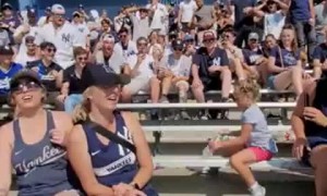Fans at Yankees game cheer for little girl's bottle flip