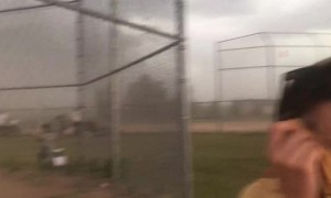 Softball Game Interrupted by Intensely Strong Winds