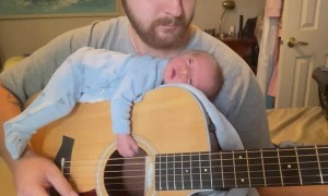 Infant Falls Asleep to Soft Sounds on Dad's Guitar