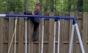 Kid Gets Stuck Trying to Climb Fence