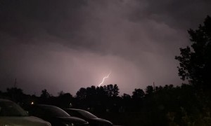 Slow Motion Lightning Branches Through Dark Skies