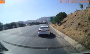 Truck Plows into Opposite Lane Nearly Causing an Accident