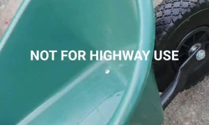 Wheelbarrow With a Funny Warning