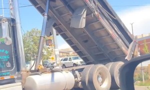 Semi-Truck Gets Stuck on Traffic Light Pole