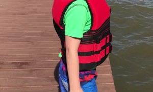 Kid Tries to Hype Himself Up to Jump Off Dock