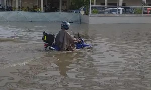 Motorcyclist Makes Valiant Attempt to Drive Through a Flood