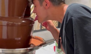 Guy Trying to Lick Chocolate Fountain Fails