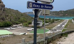 An Airplane Landing Close Enough To Touch