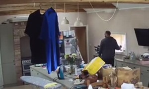 Girl hilariously hits her head on the fridge after playful fight with dad 