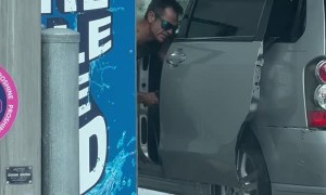 Man Uses Power Washer on Car Interior