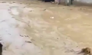 Casually cooking breakfast during insane flooding right outside