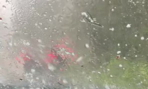 People wait in their car after surprise extreme hail storm 