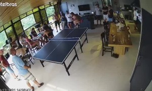 Guy Playing Ping Pong Takes a Dive on the Table