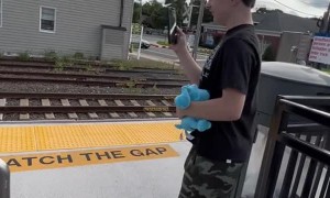 Train Horn Startles Kid and He Drops His Phone