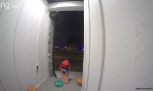 Generous Trick-or-Treater Puts His Own Candy into Empty Bowl