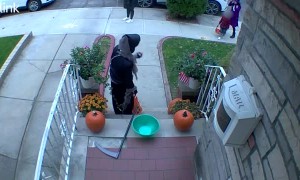 Kid Refills Halloween Candy Bowl From His Own Bag