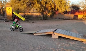Kiddo Crashes Dirt Bike on Homemade Ramp