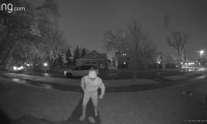 Slick Steps From Ice Storm Surprise Man Walking to Truck