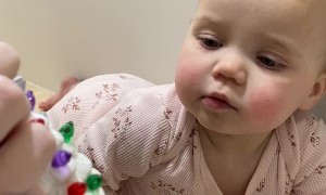 Baby Girl's Adorable Reaction to Light-Up Christmas Ornament