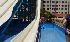 Grandmother Climbs into Water Slide and Gets Hit
