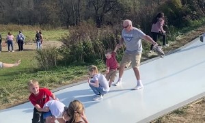 Man Thinks on His Feet to Avoid Collision on Slide