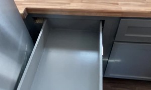 Carpenter Showcases Sliding Drawer Near Fridge