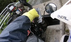 Bikers Topple on Rain Slick Bridge