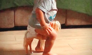 Toddler Tries His Best to Ride Small Horse Toy