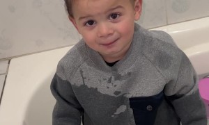Toddler Climbs into Bathwater Fully Clothed