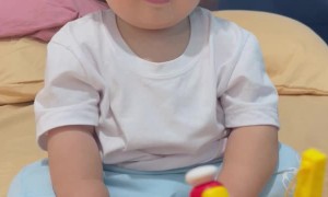 Baby Boy Doesn't Find Toy Very Funny