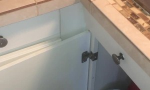 Rescuing a Cat Stuck Behind Kitchen Cabinets