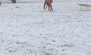 Woman Acting Like a Horse on the Beach