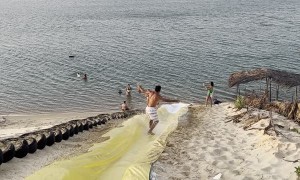Man Surfs Down Waterslide and Somersaults Into Water