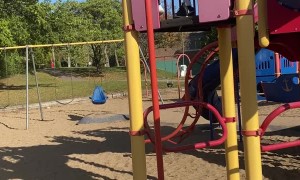 Kiddo Jumps Down Pole at Park Inside of Sliding Down It