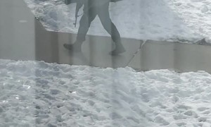 Man Circles Apartment Building With Firearm