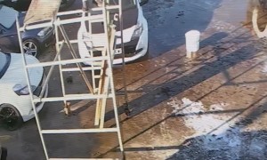 Man Falls From Scaffolding and Smashes Into Car Windshield