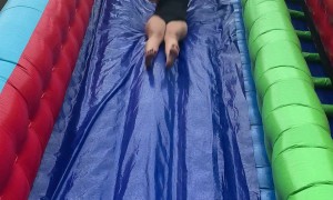 Woman Gets Bounced Off of Slippery Slide