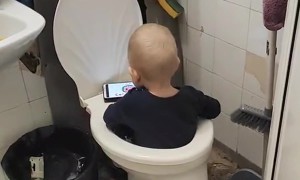 Kid Sits in Toilet While Watching Cartoons