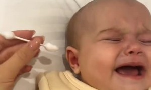 Baby hilariously cries when ear cleaning stops