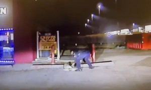 Police officer removes jar from raccoon's head