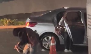 University Student Slips in Pouring Rain