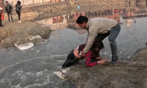 Woman Fails to Clear Jump Across Water