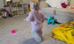 Little Girl Wears Mom's Slippers