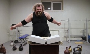 Man Breaking A Concrete Block With His Head