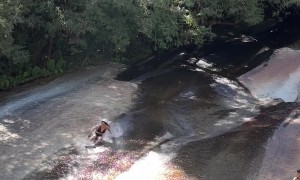Woman Rides Down Waterfall and Hits People Sitting Below