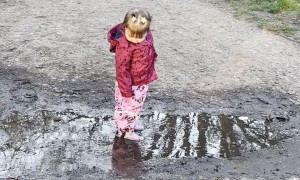 Girl Finds Joy in a Mud Puddle