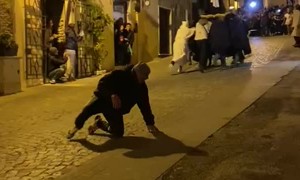 Carriers Fall During Procession